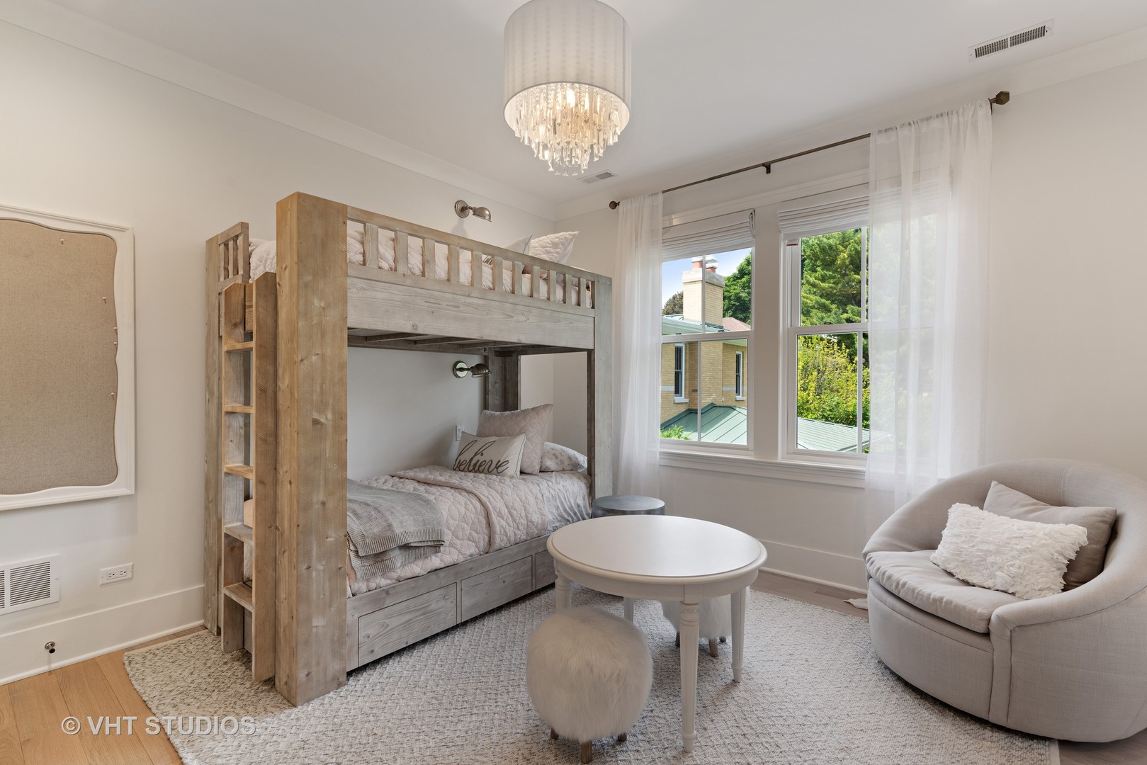 300 Greenleaf Avenue Wilmette, IL 60091 - Photo 22 of 43 a bedroom with a bed and a chandelier