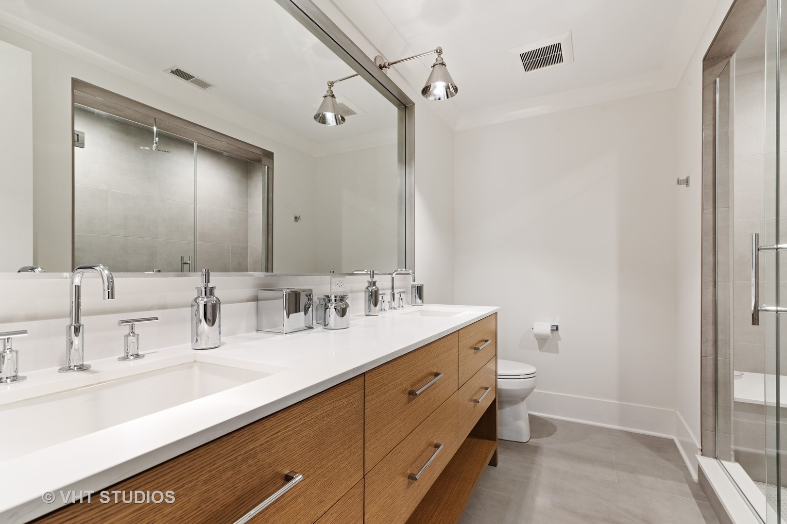 300 Greenleaf Avenue Wilmette, IL 60091 - Photo 23 of 43 a bathroom with a double vanity sink and mirror