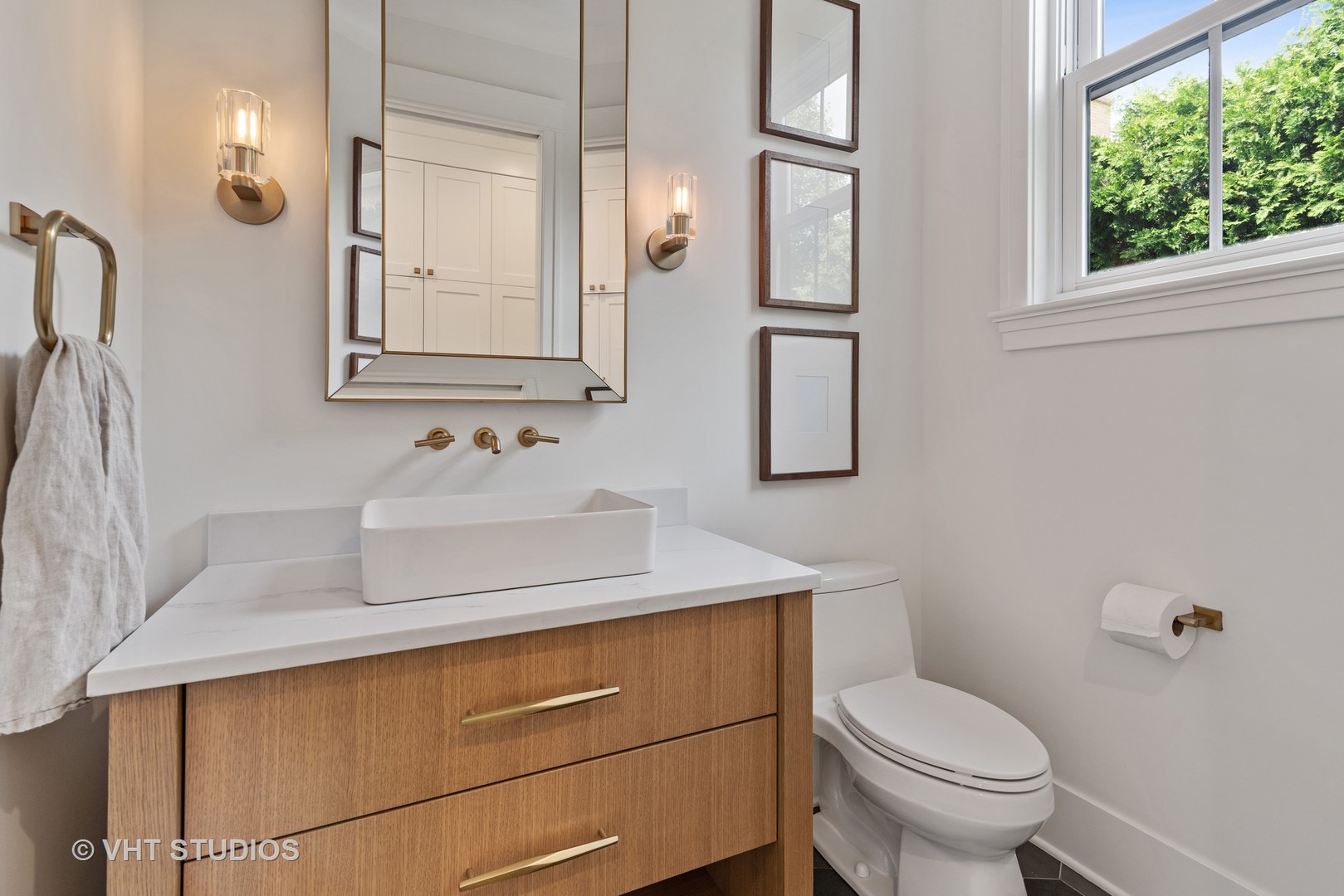 300 Greenleaf Avenue Wilmette, IL 60091 - Photo 25 of 43 a bathroom with a sink toilet and mirror