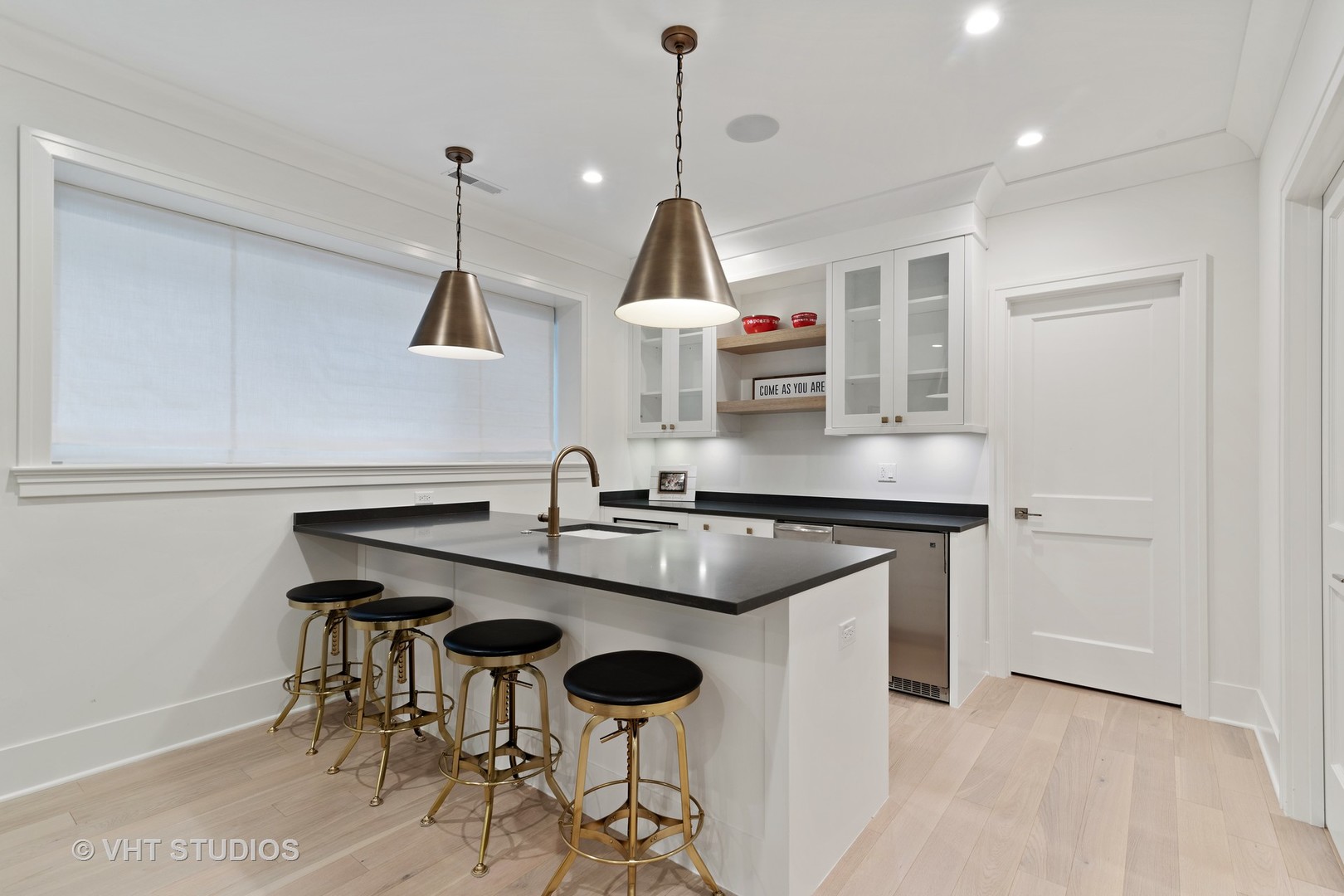 300 Greenleaf Avenue Wilmette, IL 60091 - Photo 29 of 43 a kitchen with a sink cabinets and wooden floor