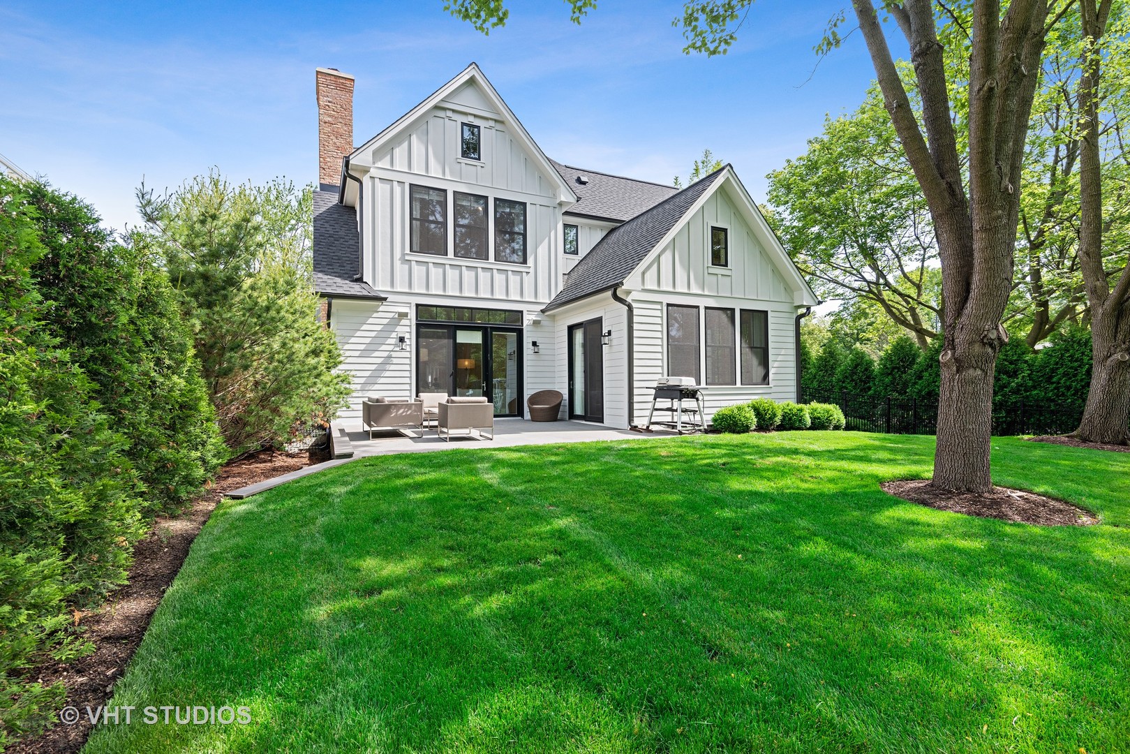 300 Greenleaf Avenue Wilmette, IL 60091 - Photo 36 of 43 a front view of a house with a yard and green space