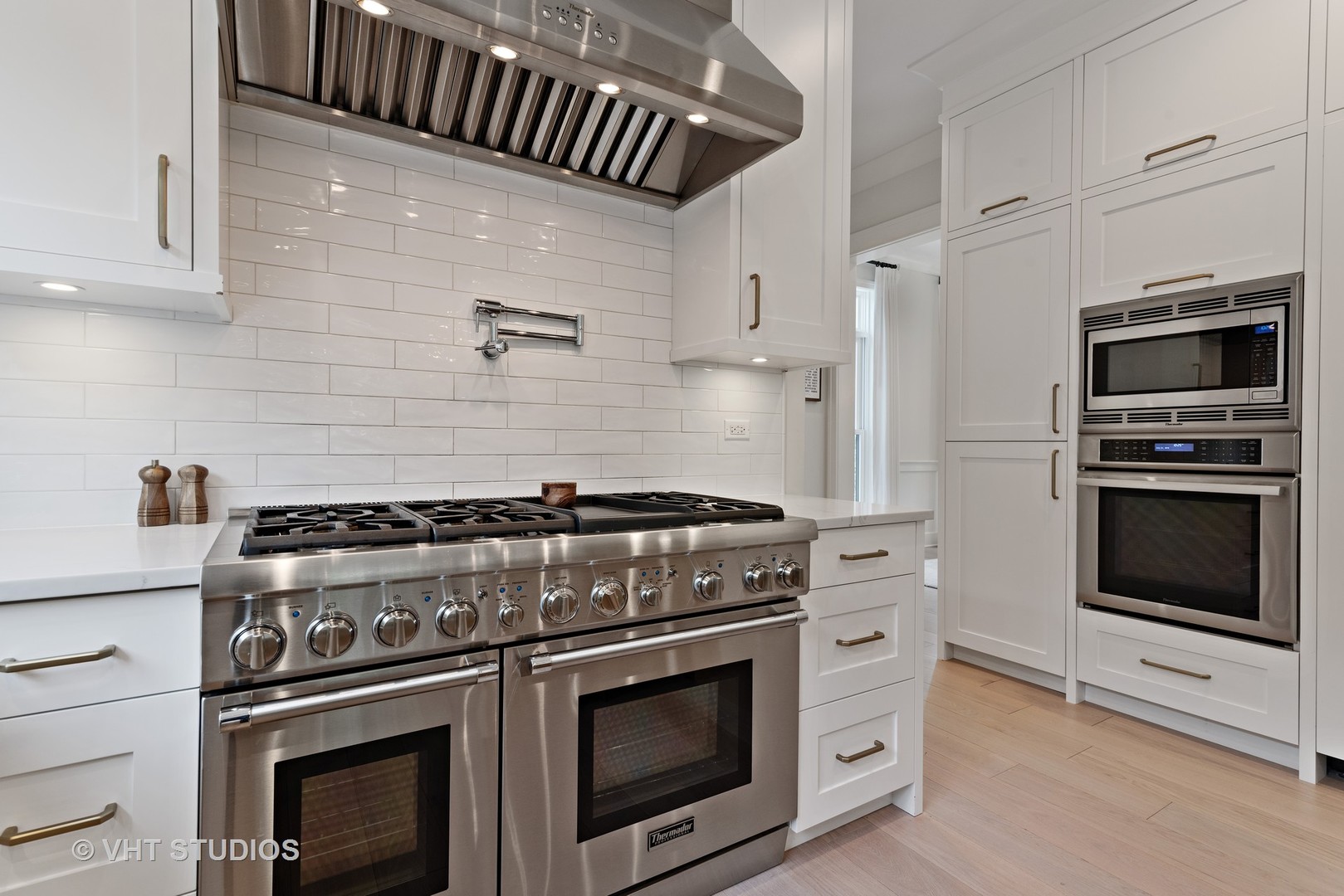 300 Greenleaf Avenue Wilmette, IL 60091 - Photo 7 of 43 a stove top oven sitting inside of a kitchen