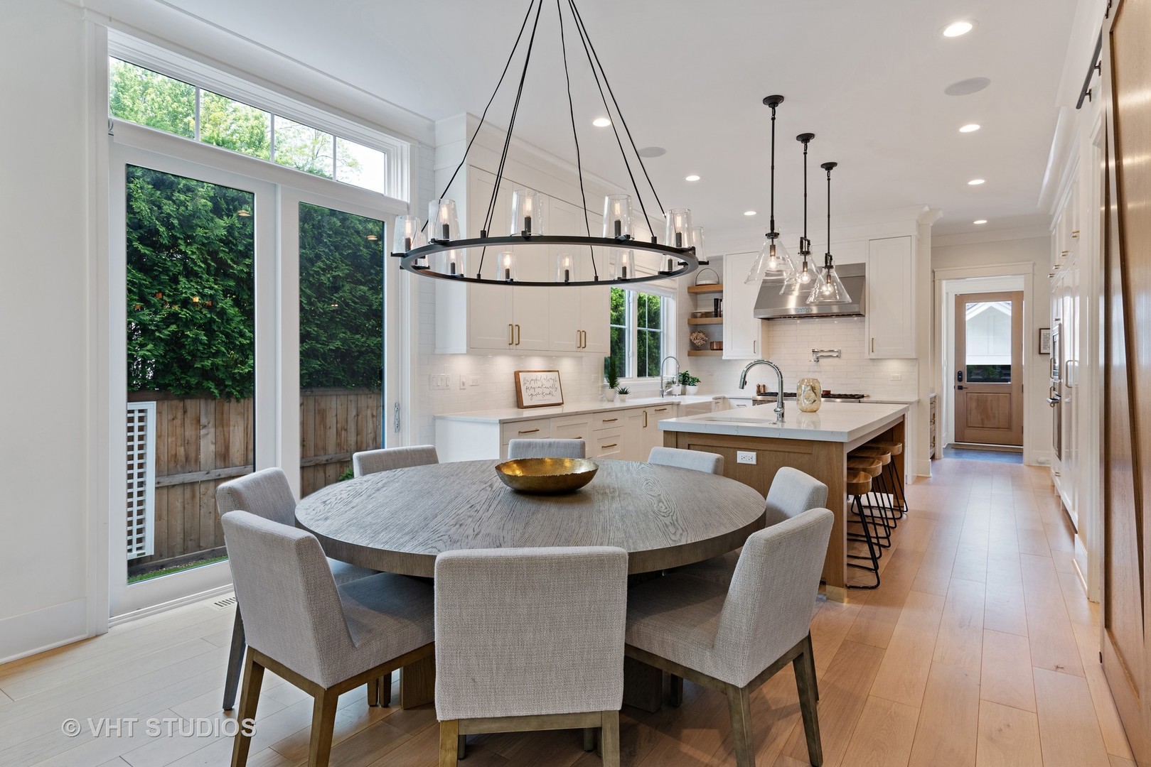 300 Greenleaf Avenue Wilmette, IL 60091 - Photo 8 of 43 a dining room with furniture a chandelier and wooden floor