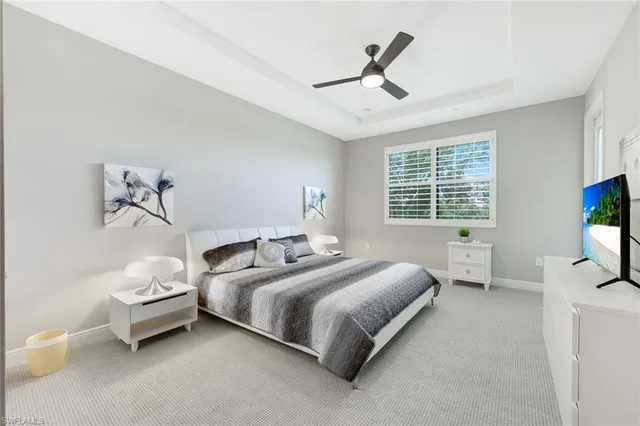 a bedroom with a bed and a tv