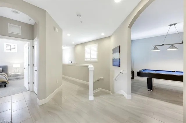 a view of a hallway with seating area