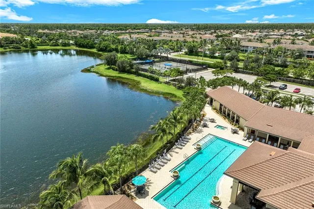an aerial view of a house with a lake view