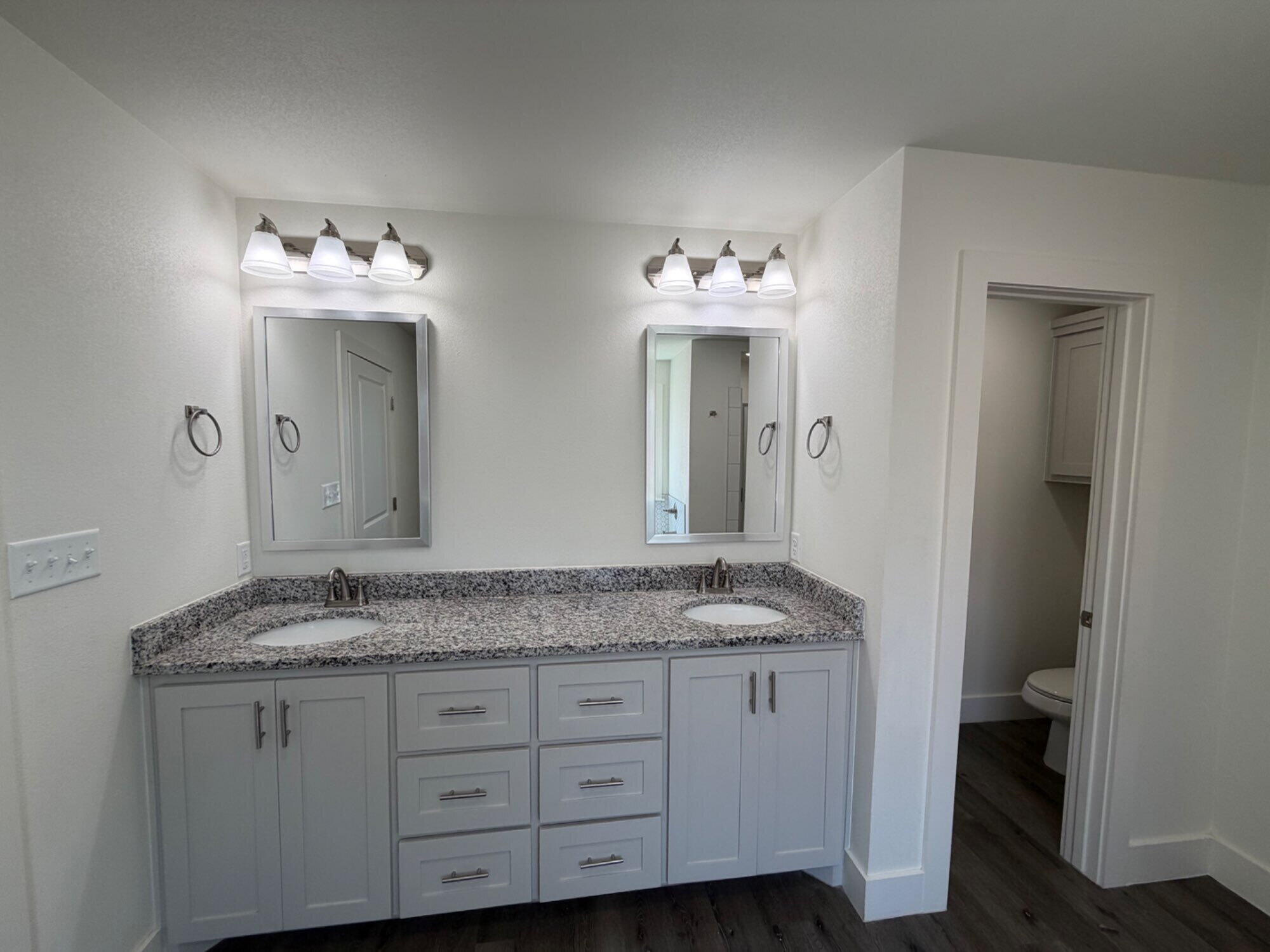 405 Ranger Street Wolfforth, TX 79382 - Photo 11 of 19 a bathroom with a sink and a mirror