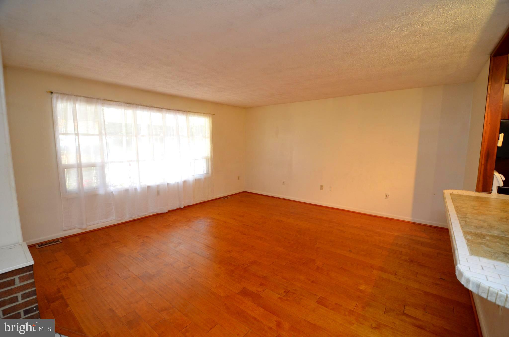 5360 Solomons Island Road Huntingtown, MD 20639 - Photo 6 of 46 Living room with hardwood floors