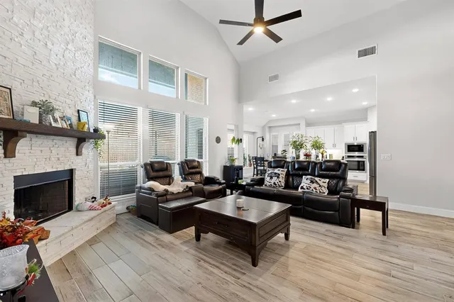 a living room with furniture and a fireplace
