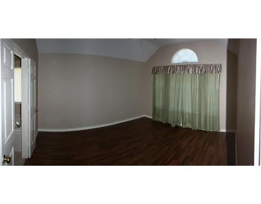 a en suite bathroom with a sink and a mirror