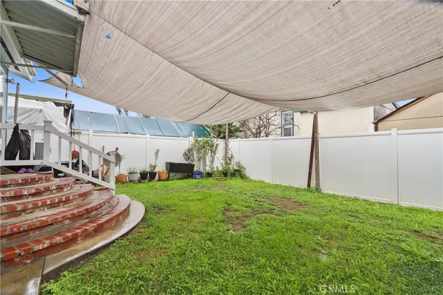 a view of a backyard with garage