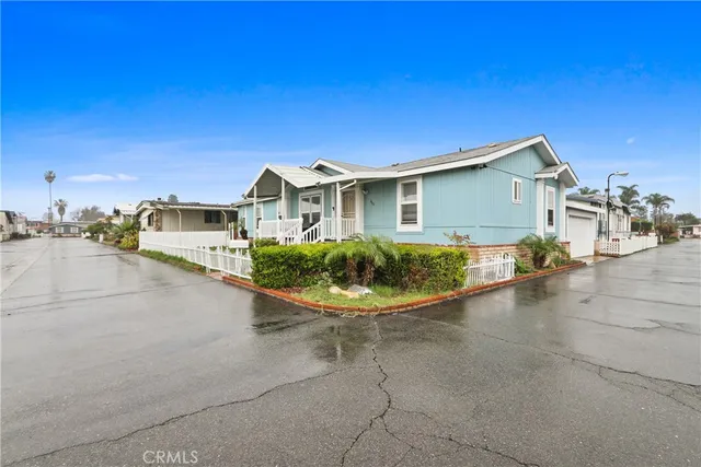 a view of a house with a backyard space