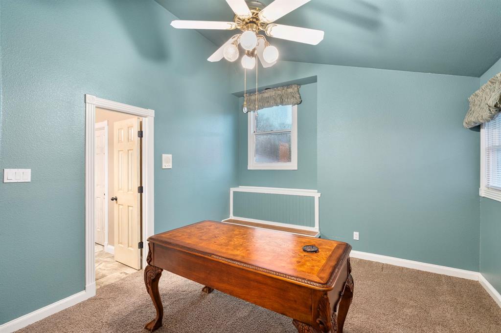 10080 Arvin Hill Road Aubrey, TX 76227 - Photo 26 of 40 a room with a bed and a chandelier