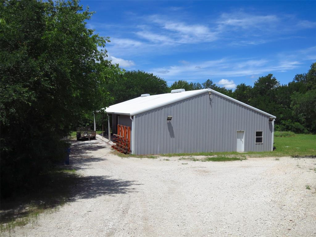 10080 Arvin Hill Road Aubrey, TX 76227 - Photo 34 of 40 a view of a house with a yard