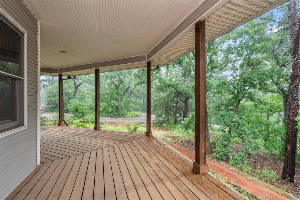 10080 Arvin Hill Road Aubrey, TX 76227 - Photo 8 of 40 a view of a room with wooden floor and deck