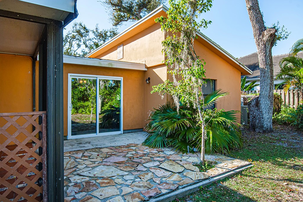 575 Acacia Road Vero Beach, FL 32963 - Photo 12 of 28 a view of a house with porch and a patio