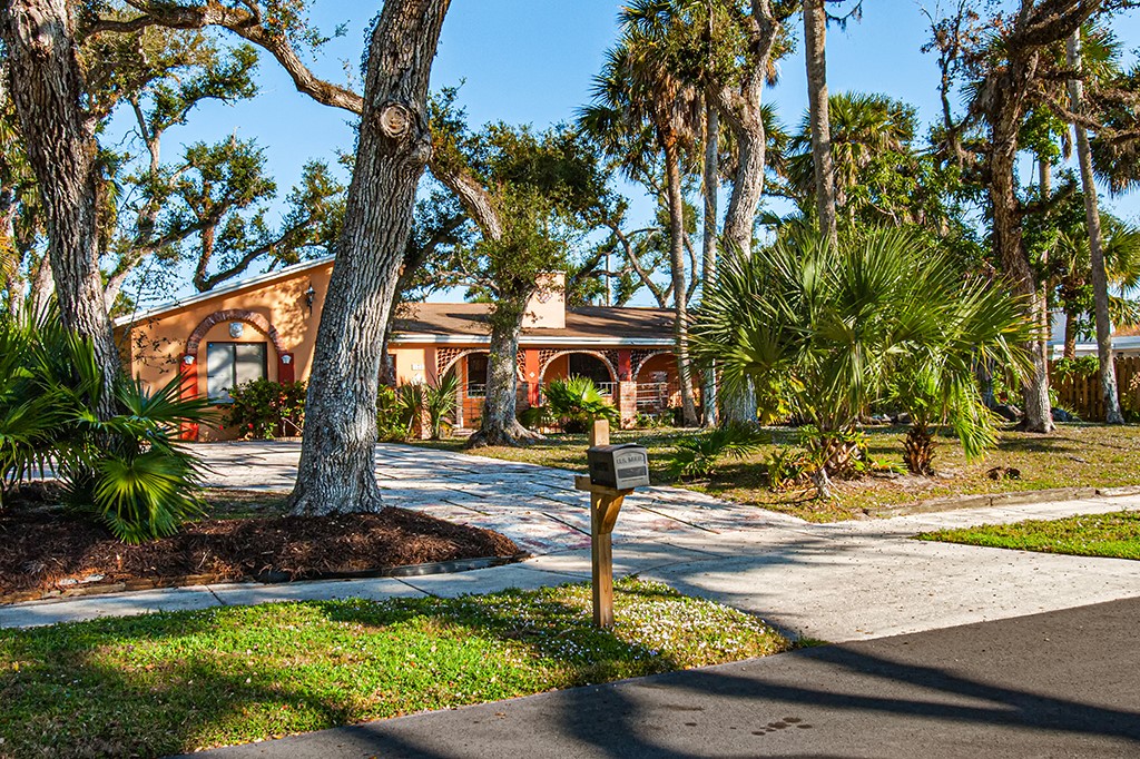 575 Acacia Road Vero Beach, FL 32963 - Photo 2 of 28 a view of a yard with plants
