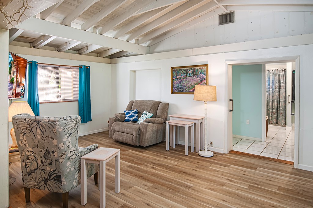 575 Acacia Road Vero Beach, FL 32963 - Photo 21 of 28 a living room with furniture and a wooden floor