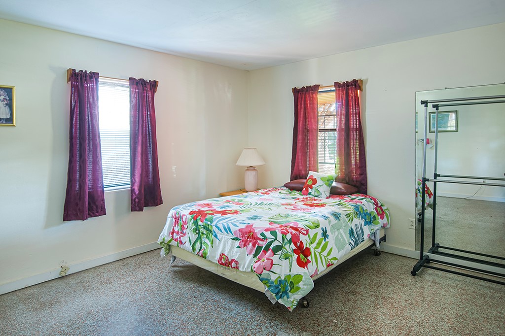 575 Acacia Road Vero Beach, FL 32963 - Photo 24 of 28 a bedroom with a bed and a window