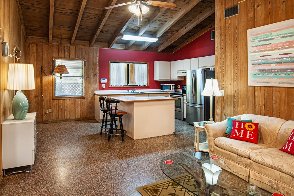 575 Acacia Road Vero Beach, FL 32963 - Photo 28 of 28 a kitchen with stainless steel appliances granite countertop a stove and a refrigerator