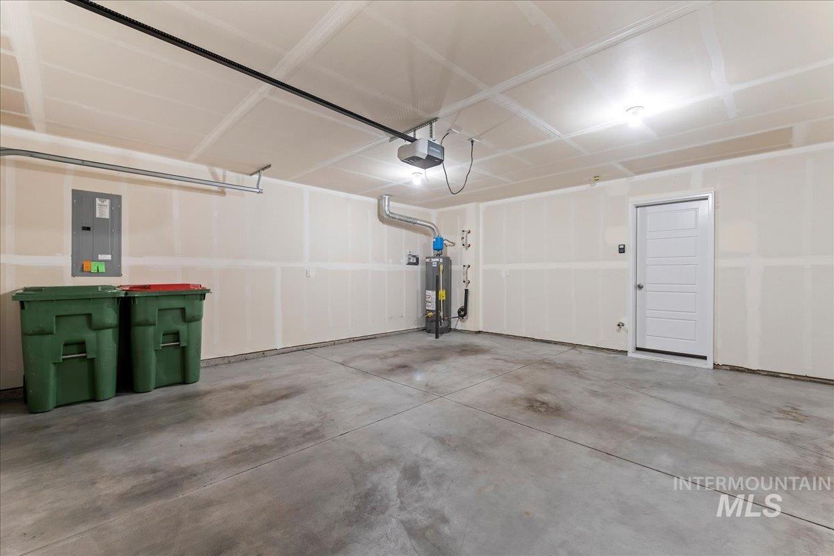 2501 East Goldstone Street Meridian, ID 83642 - Photo 20 of 26 Garage featuring electric panel, gas water heater, and a garage door opener