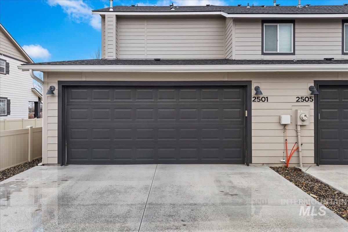 2501 East Goldstone Street Meridian, ID 83642 - Photo 23 of 26 Garage featuring concrete driveway