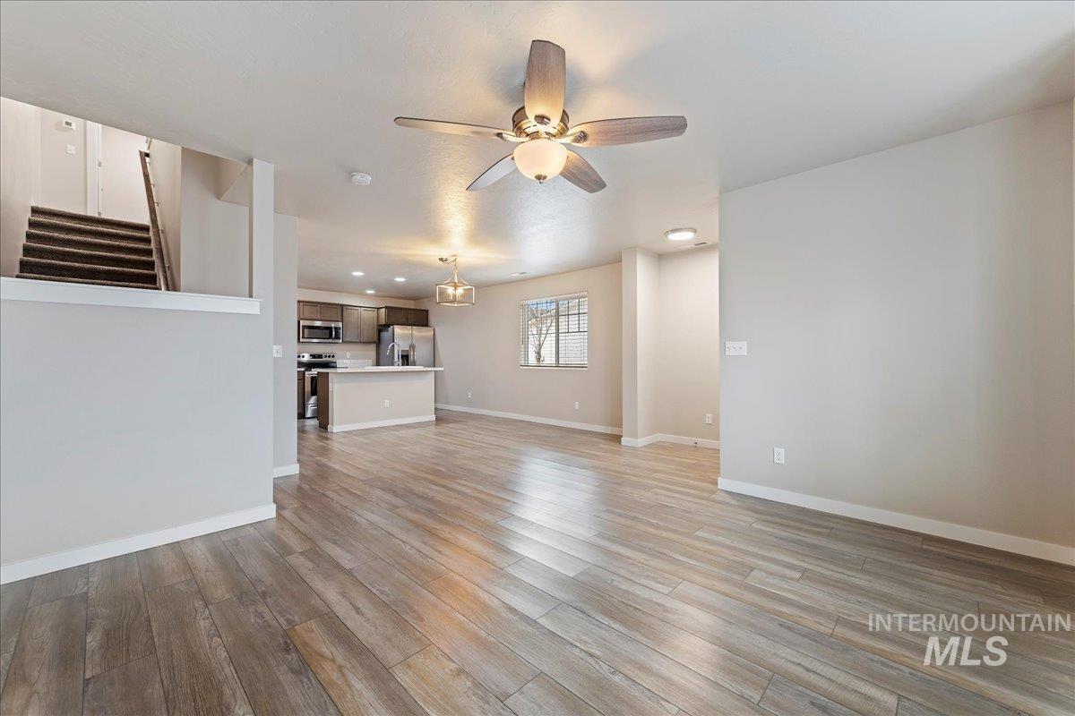 2501 East Goldstone Street Meridian, ID 83642 - Photo 6 of 26 Unfurnished living room featuring a ceiling fan, light wood-type flooring, and recessed lighting