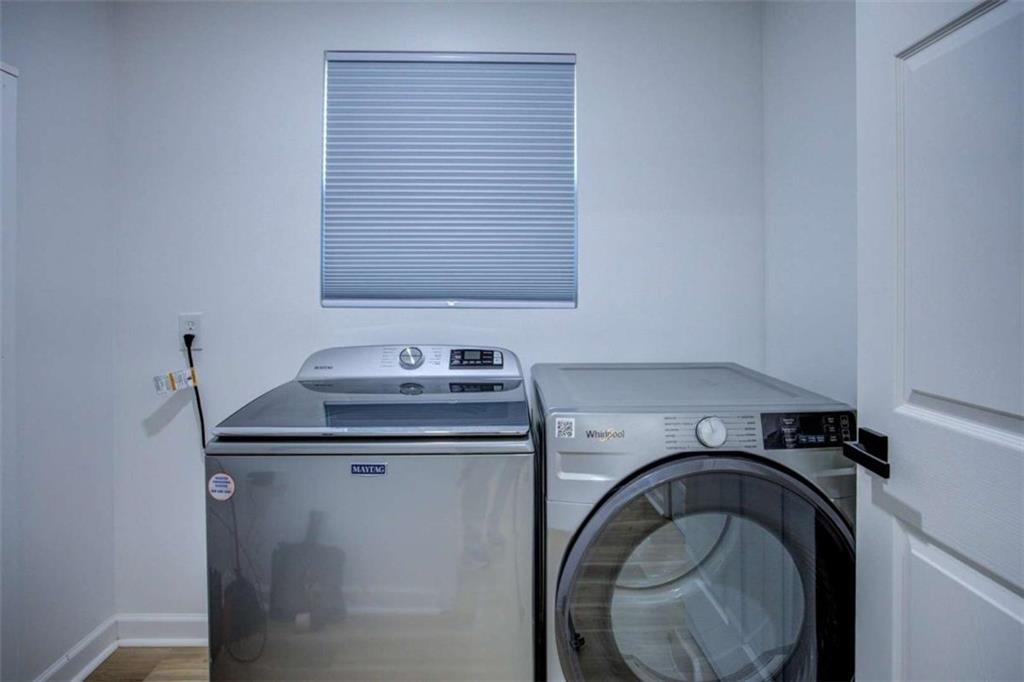 7225 Pineneedle Drive Southwest Covington, GA 30014 - Photo 17 of 37 a utility room with sink dryer and washer
