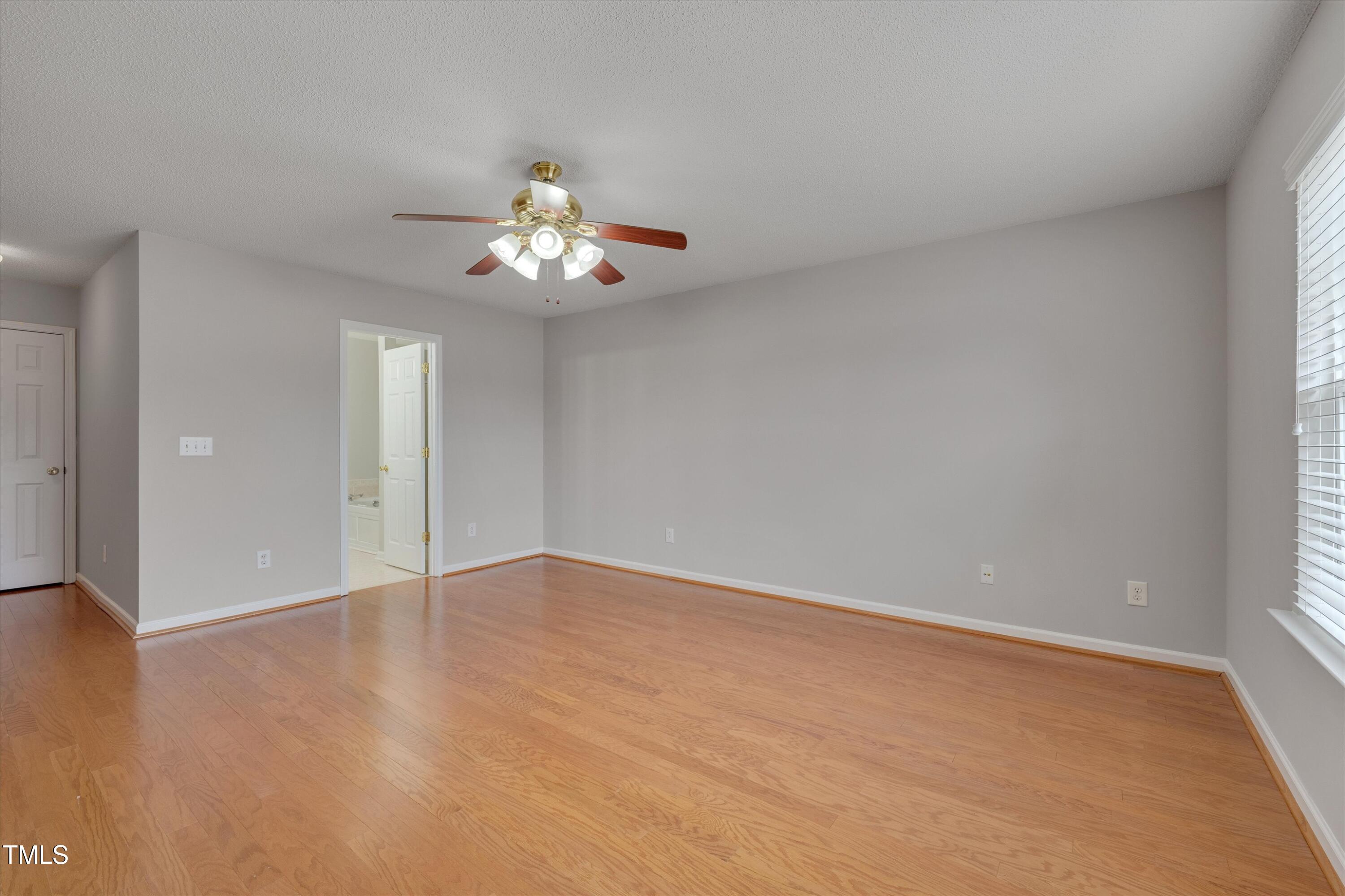 3217 Flowery Branch Road Raleigh, NC 27610 - Photo 5 of 12 a view of an empty room with a window