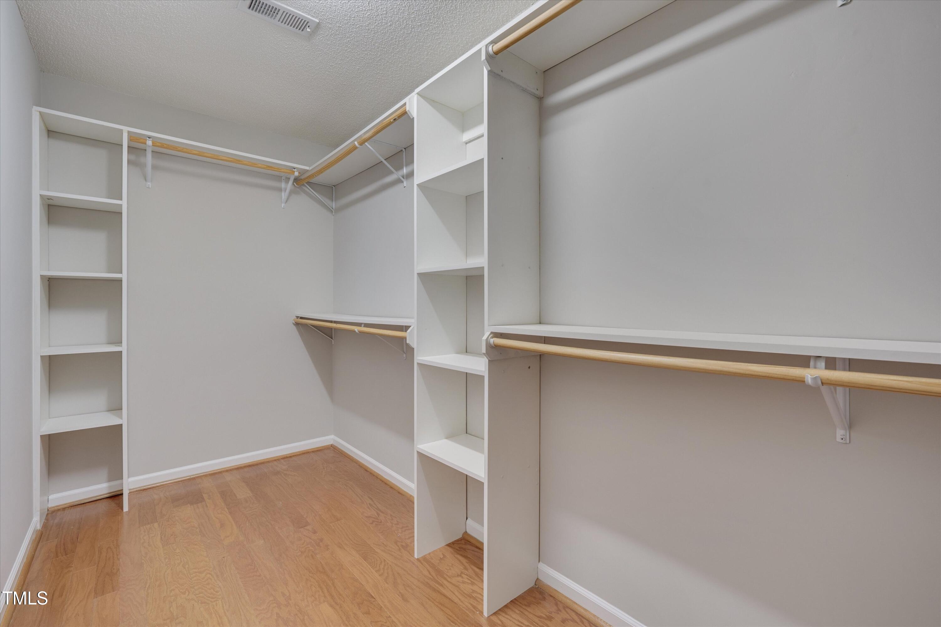 3217 Flowery Branch Road Raleigh, NC 27610 - Photo 6 of 12 a view of an empty walk in closet