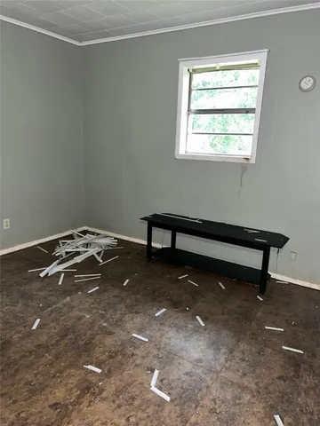 a view of a room with rack on the wall and a window