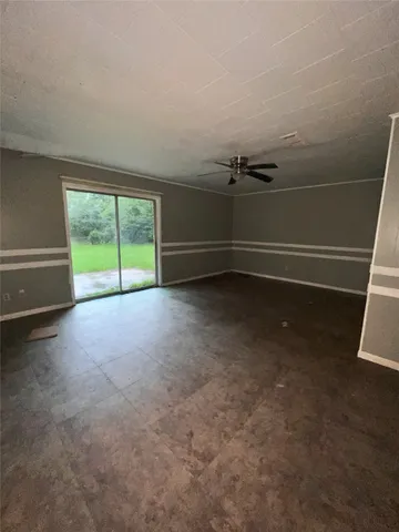 a view of a room with air conditioner and window