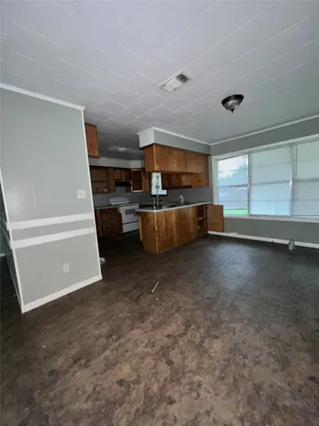 a view of living room with furniture and flat screen tv
