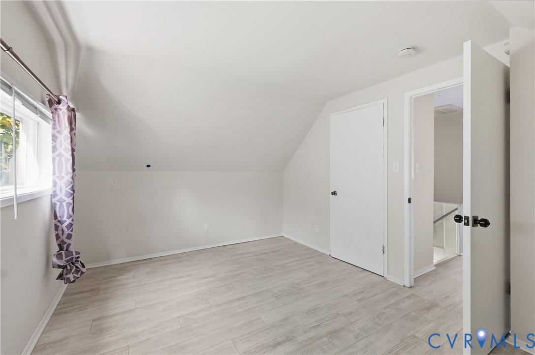 9207 Mapleway Road Richmond, VA 23229 - Photo 28 of 36 Vaulted ceiling, light wood-finish flooring, white