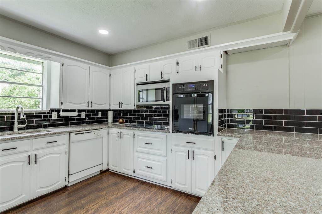925 West Lucas Road Lucas, TX 75002 - Photo 12 of 23 a kitchen with granite countertop a sink and cabinets