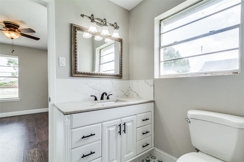 925 West Lucas Road Lucas, TX 75002 - Photo 18 of 23 a bathroom with a toilet sink and mirror