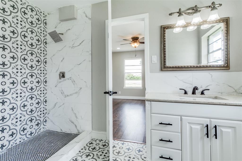 925 West Lucas Road Lucas, TX 75002 - Photo 19 of 23 a bathroom with a sink and a mirror