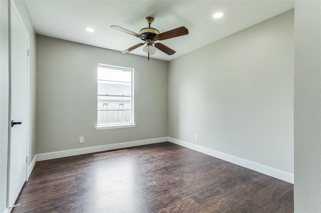 925 West Lucas Road Lucas, TX 75002 - Photo 20 of 23 an empty room with wooden floor fan and windows