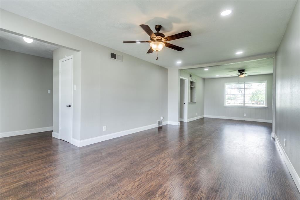 925 West Lucas Road Lucas, TX 75002 - Photo 7 of 23 a view of an empty room with wooden floor and a window