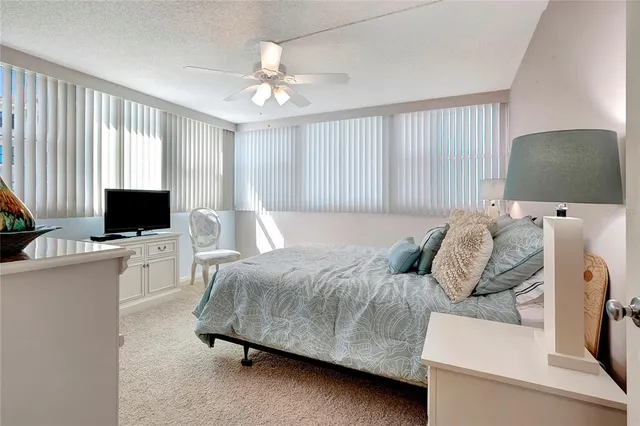 a view of hallway with wooden floor and closet