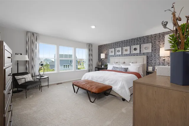 a bed room with a bed and a couch