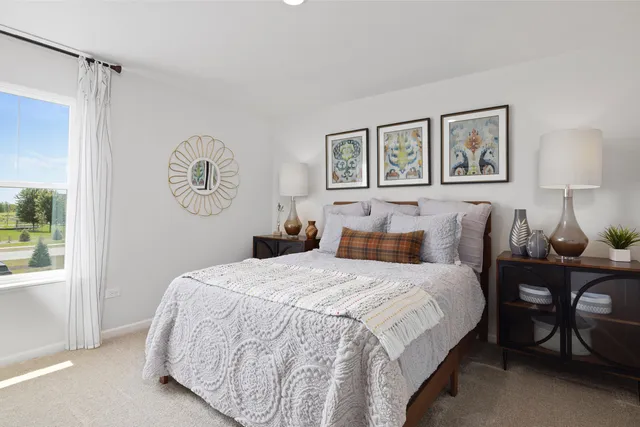 a bedroom with a bed and a table in it