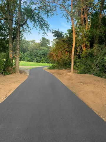 a view of a road with a yard