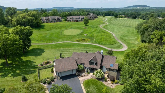 an aerial view of a house with a garden