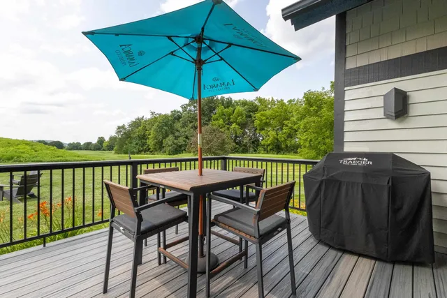 a bathroom with a granite countertop sink a toilet and a mirror
