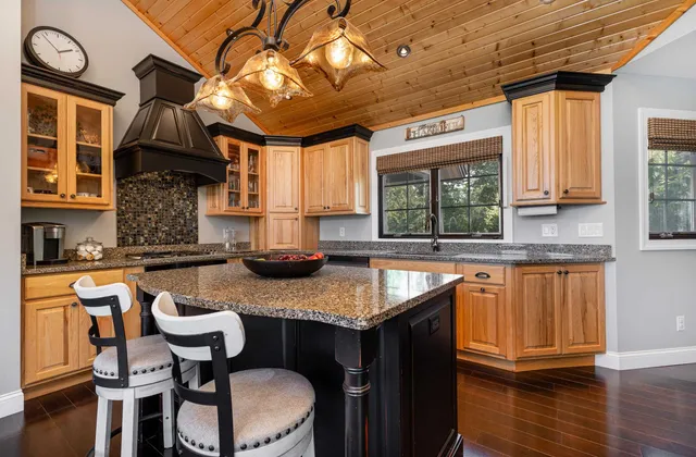 a bedroom with a bed and glass door