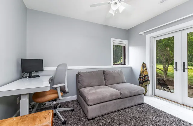 an aerial view of a house with a yard