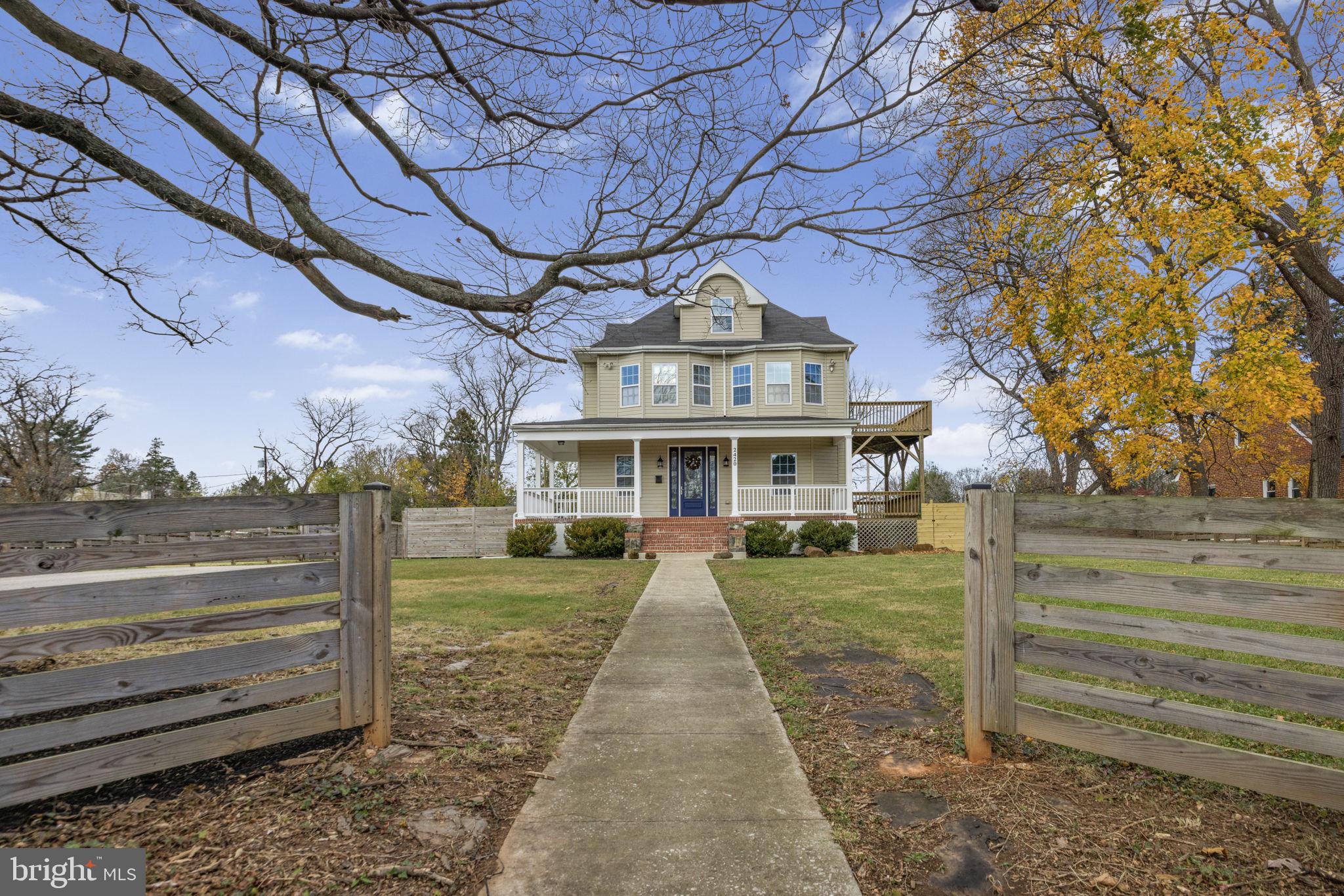 2420 West Rogers Avenue Baltimore, MD 21209 - Photo 1 of 67 a front view of a house with a yard