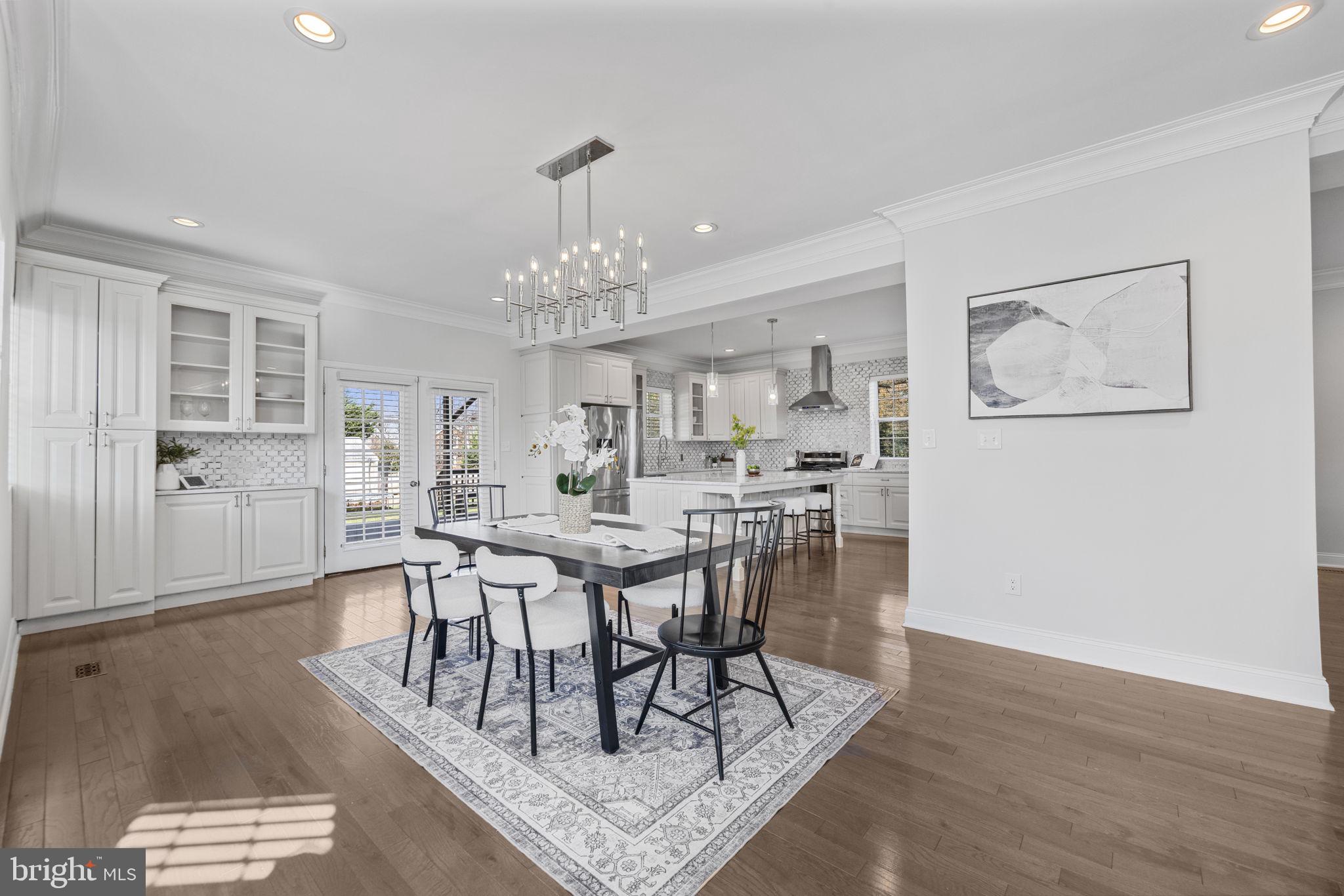 2420 West Rogers Avenue Baltimore, MD 21209 - Photo 11 of 67 a view of a dining room with furniture and wooden floor