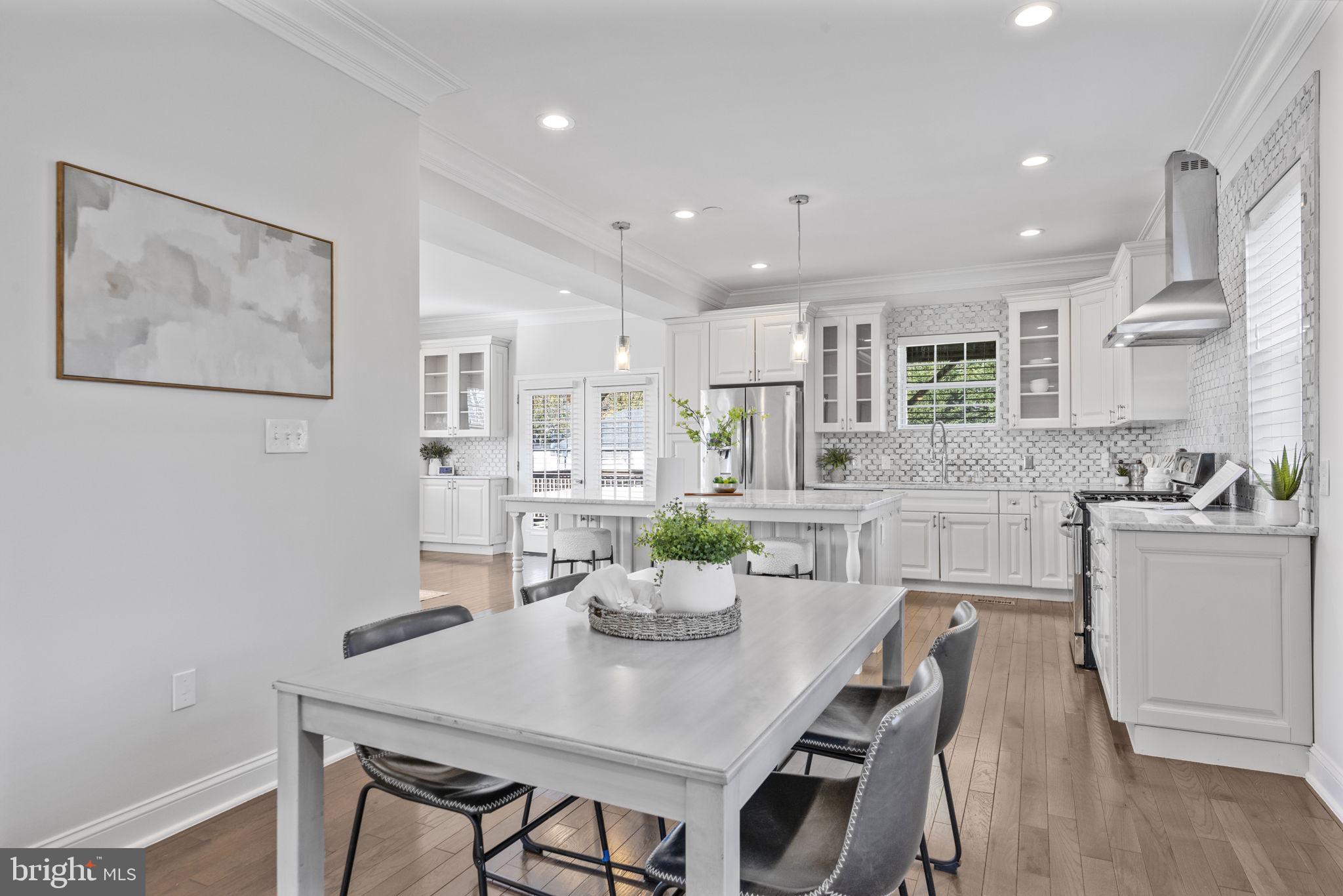 2420 West Rogers Avenue Baltimore, MD 21209 - Photo 15 of 67 a kitchen with a table and chairs